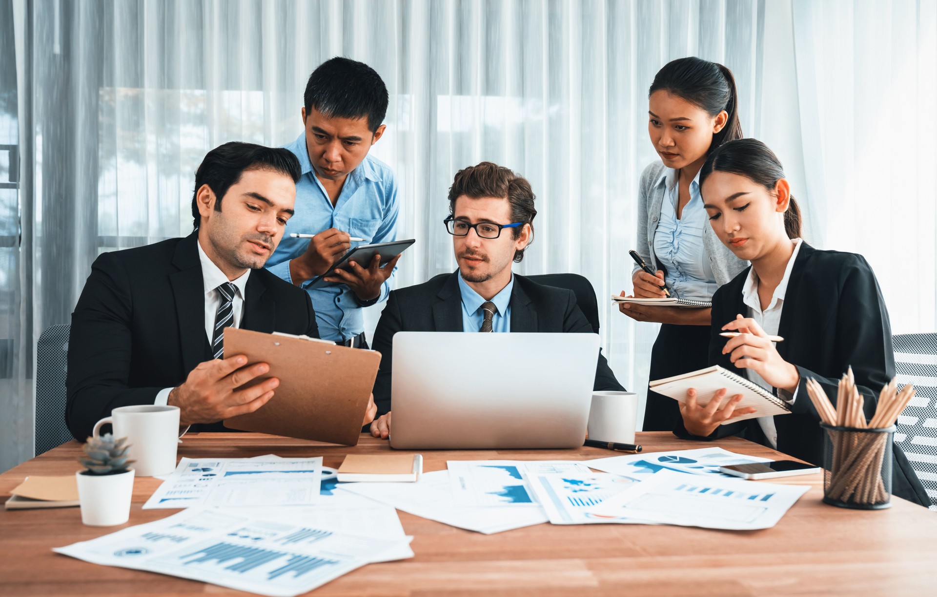 Group of business analyst team analyzing financial data report. Habiliment
